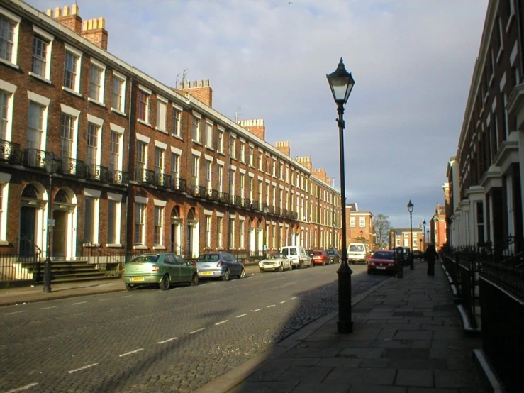 a light post is standing in front of buildings