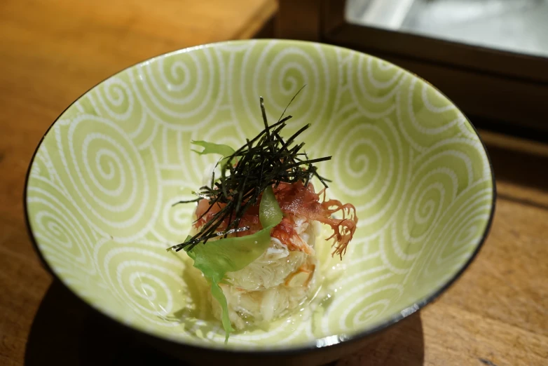 a small bowl with various ingredients in it