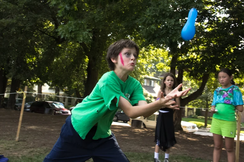 a  throws a frisbee in the park with his friends