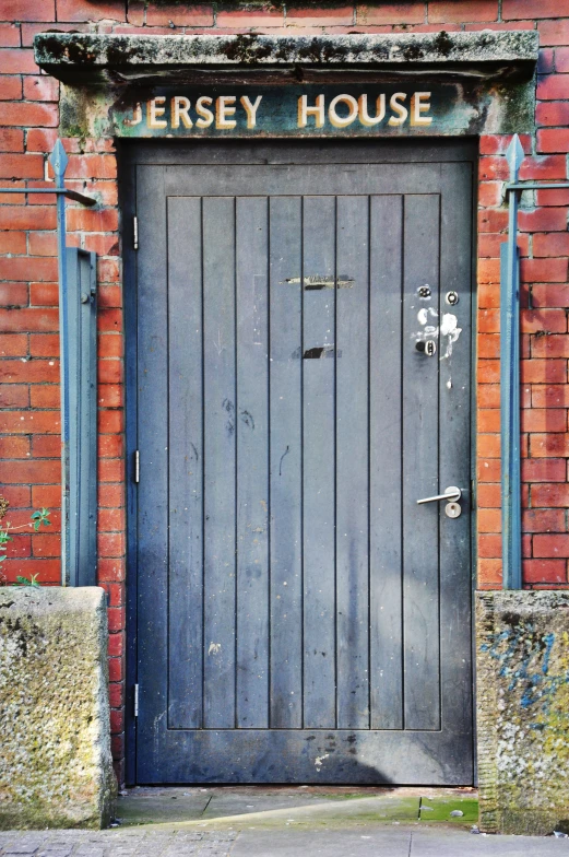 a brick building with a door to the entrance