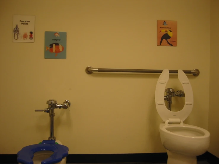 a bathroom with a toilet next to a bidet