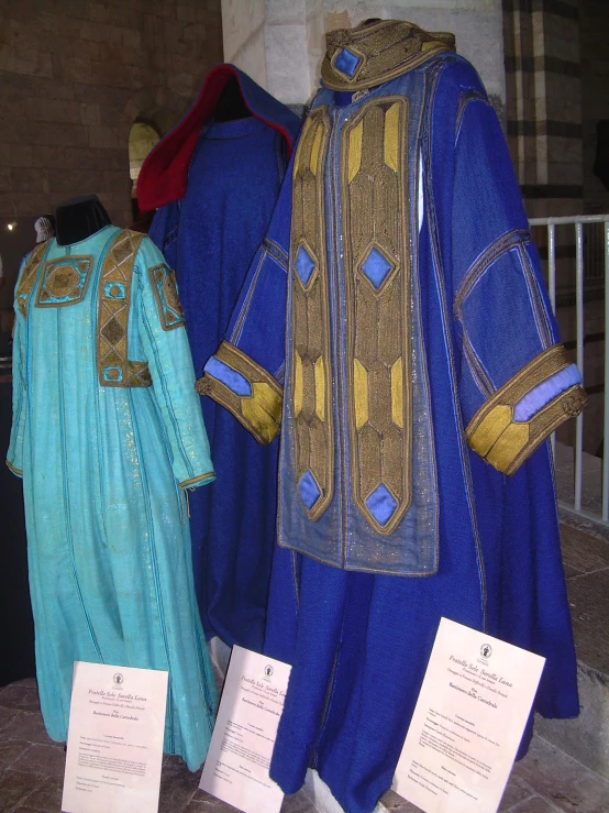 two costumed items sit on display outside a building