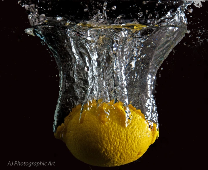 an orange is submerged in water with its head partially submerged