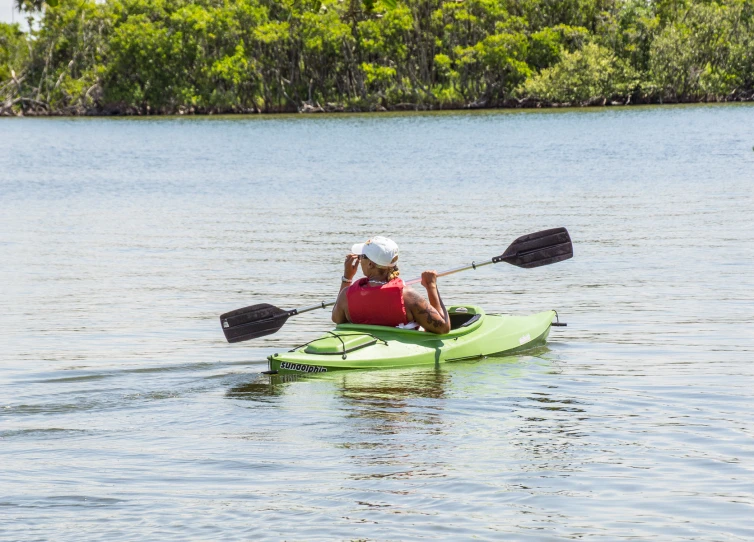 there is a man rowing on the river