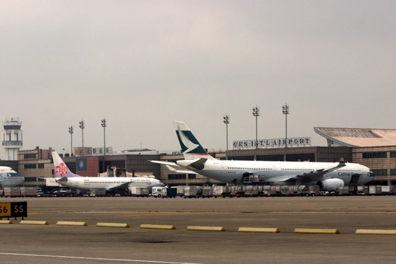 three large air planes are parked next to each other