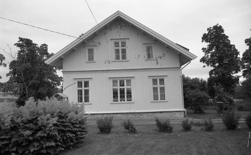 black and white image of an old style home