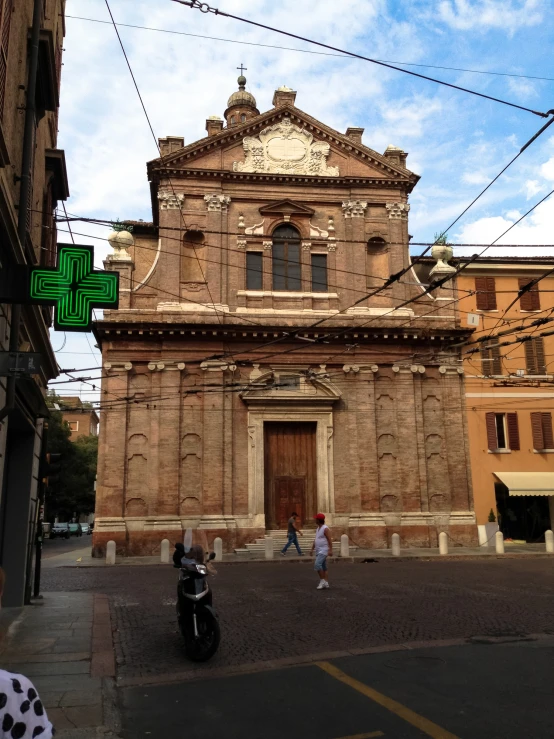 a tall building with a cross on it