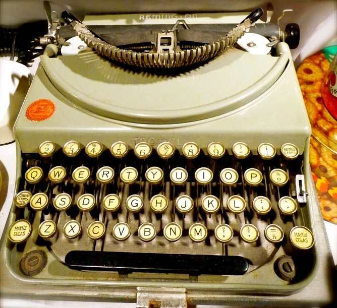 an old fashioned typewriter on top of a counter