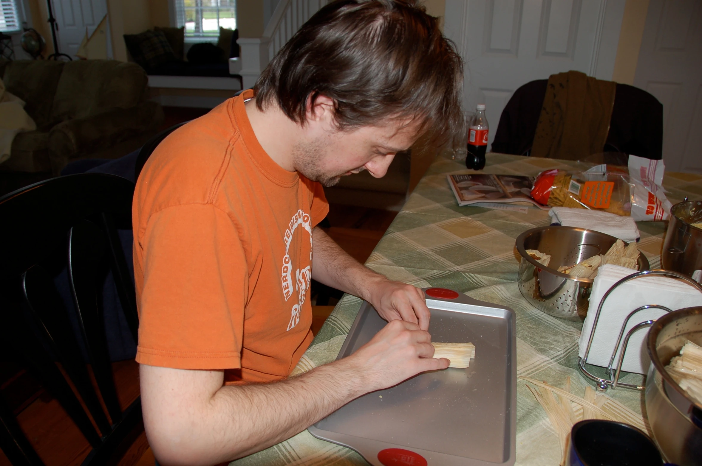 the man is using a cutter to cut out soing