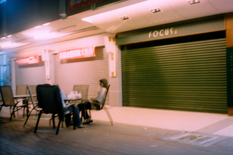 a restaurant is outside of the shuttered door