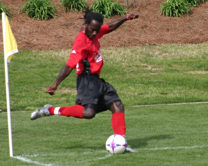 a soccer player playing in the middle of a field