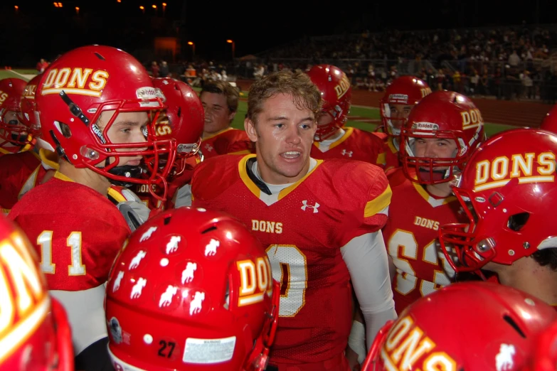 a football team is talking with each other