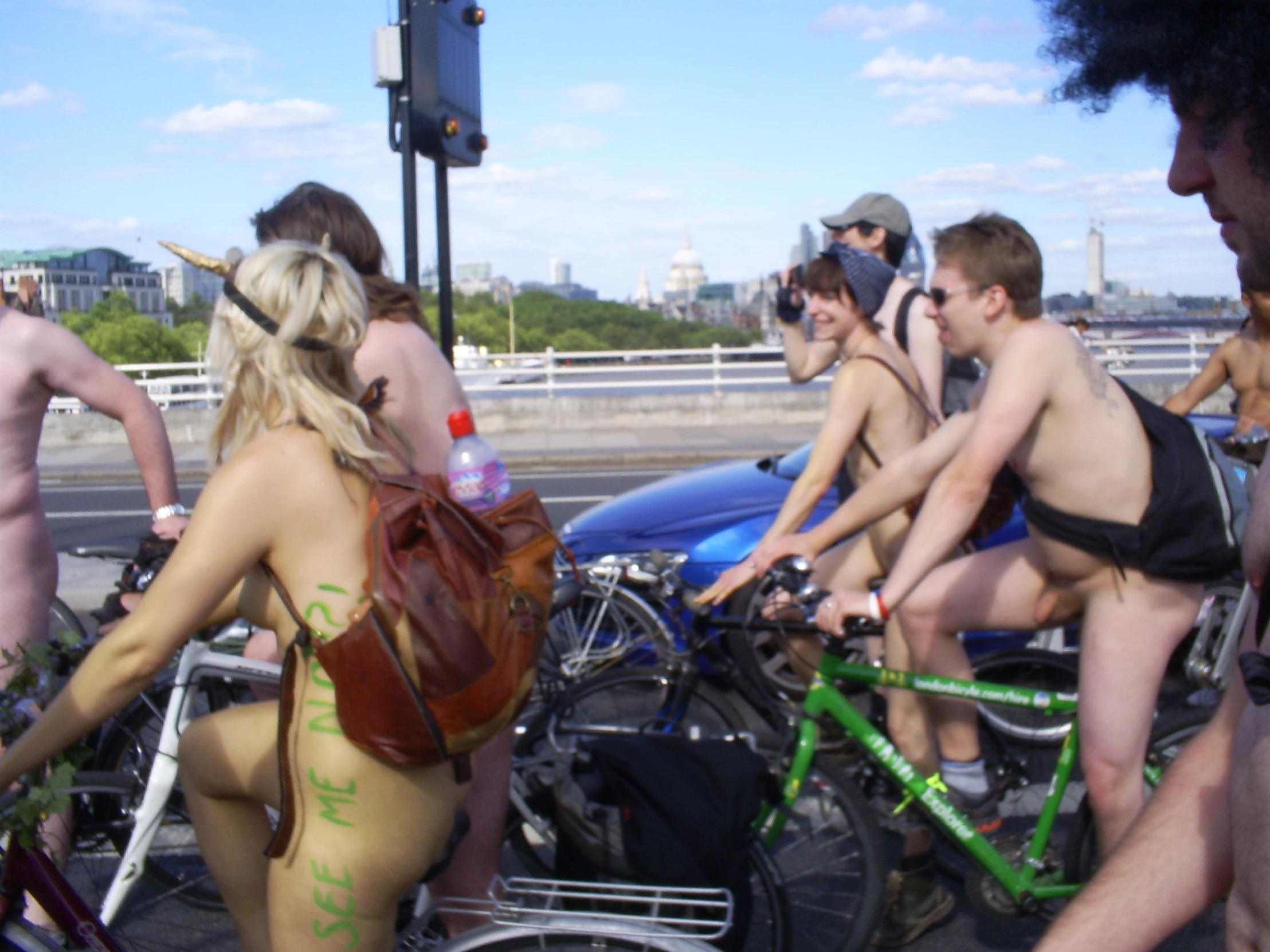 group of  guys and girls on bicycles