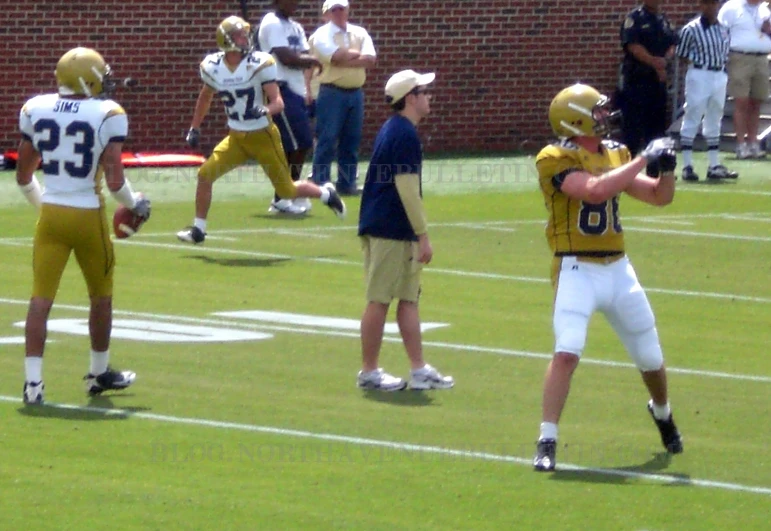 a couple of young men standing on a field