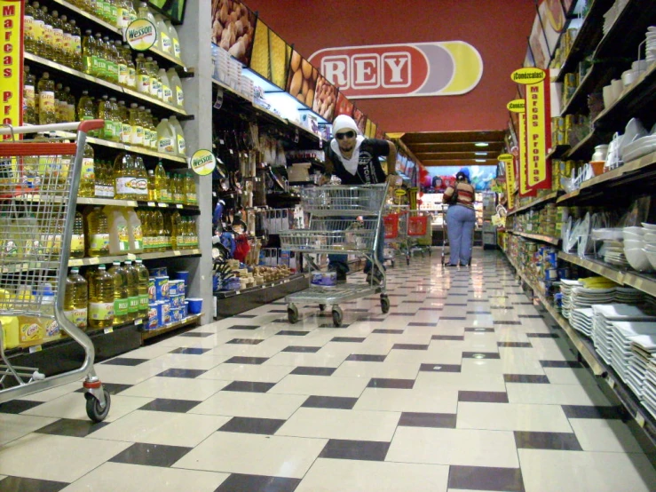 people shopping for products in a grocery store