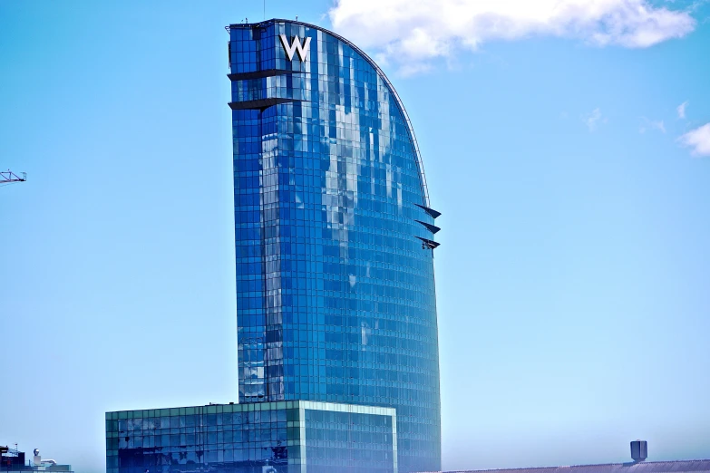 a building with many windows sitting on the side of a road