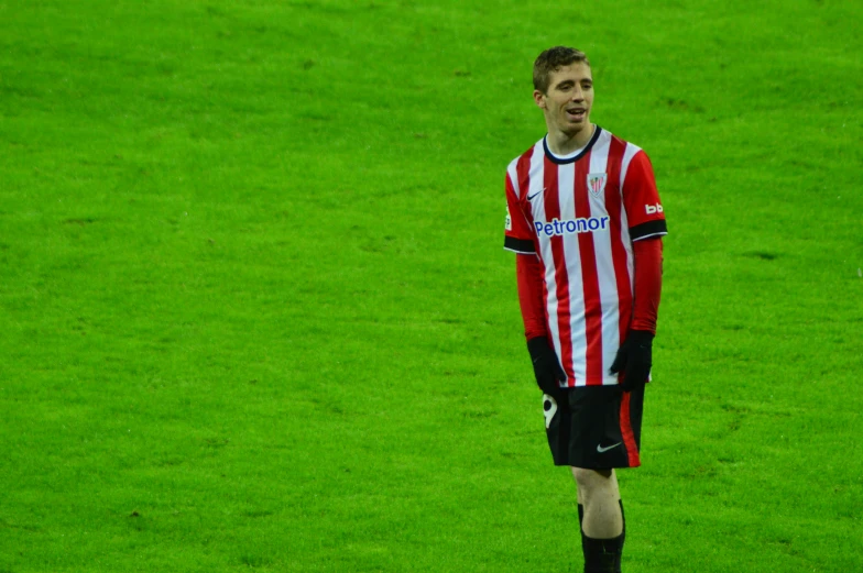 man standing on the field, wearing soccer uniform