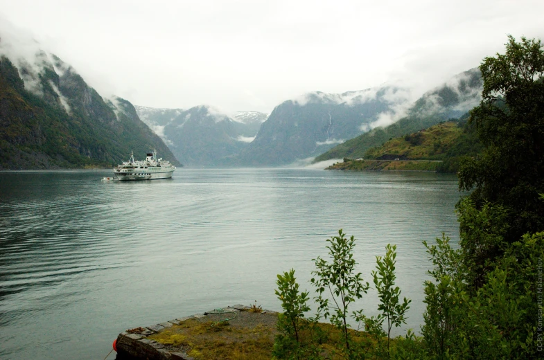 a boat traveling on a large body of water