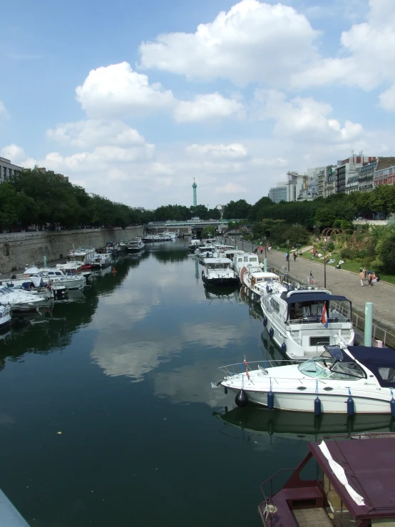 the boats are docked at the dock next to the city