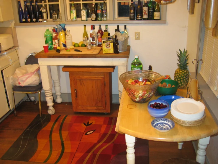 an eclectic style home bar with various bottles and bowls