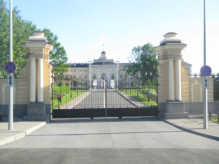 an entrance with gates on both sides and benches along both sides