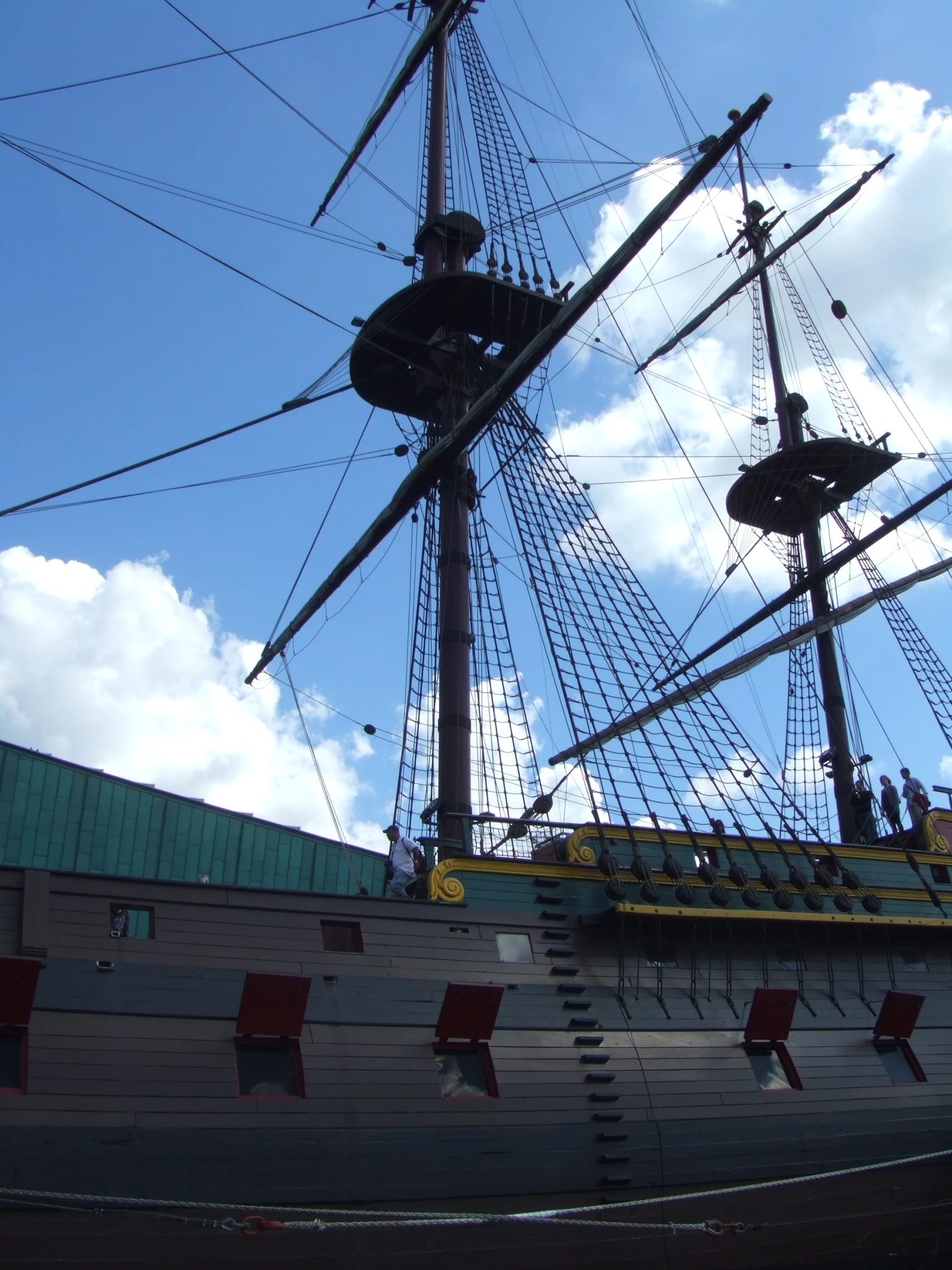 looking up at the mast of an old wooden pirate ship