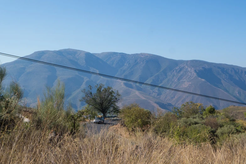 mountains behind a power line on the hillside