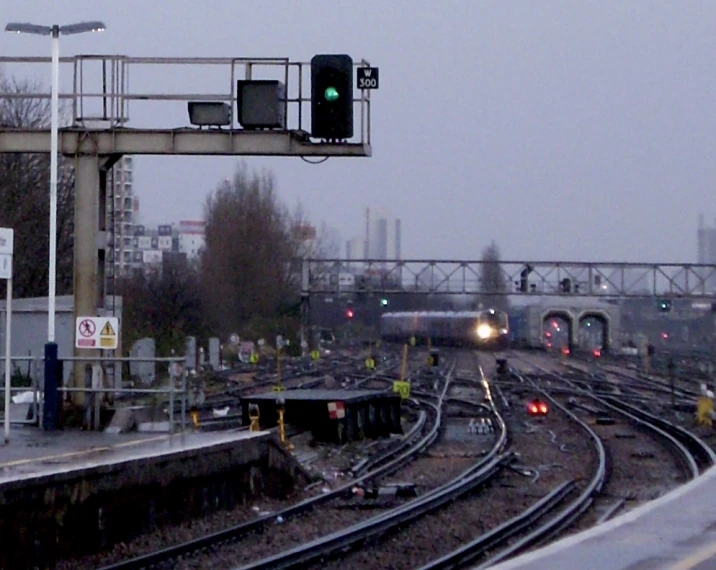 a train passing through a city during a winter storm