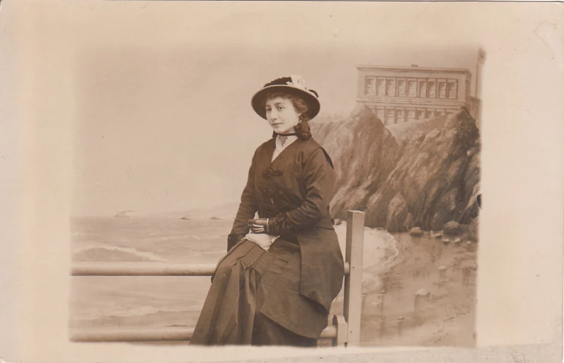 old po of woman sitting on a ledge overlooking water