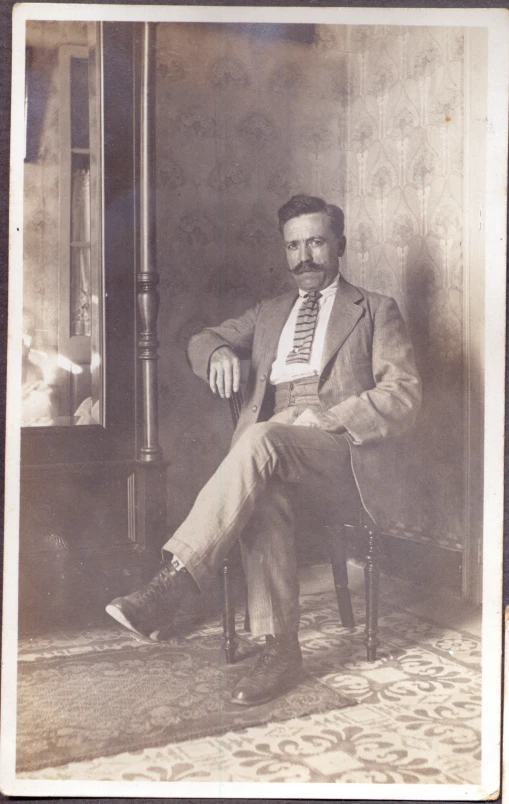 a vintage po of a man sitting down