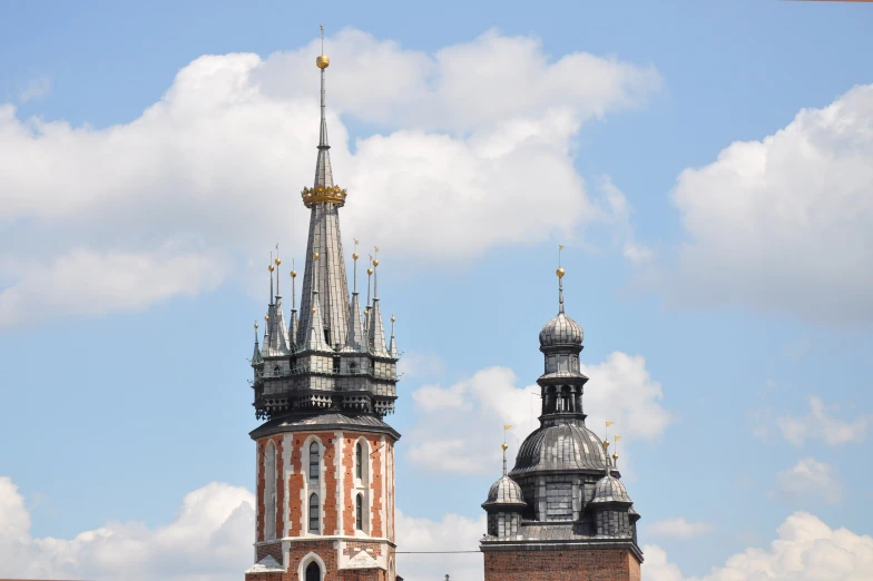 the roofs and towers of a building with a tower with spires