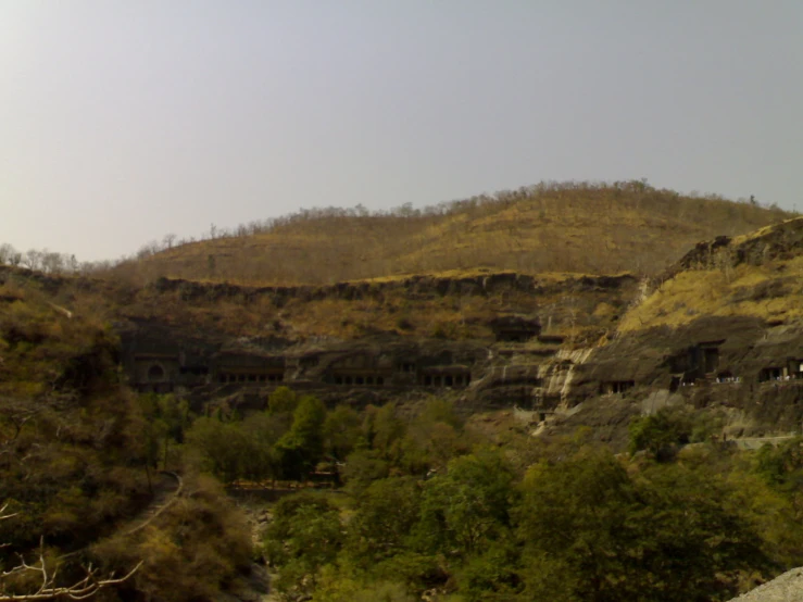 the view from the hillside of a cave city