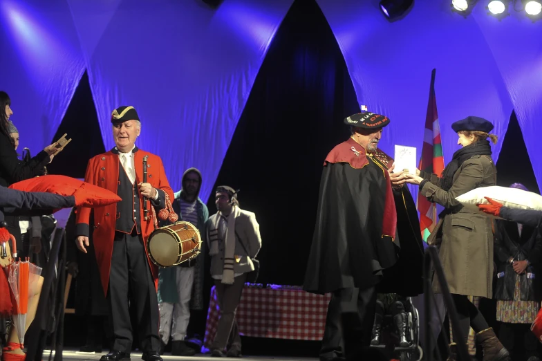 the stage crew of a play performing on a stage