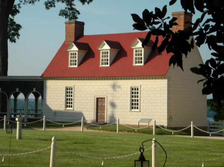 an old house is on display at a museum