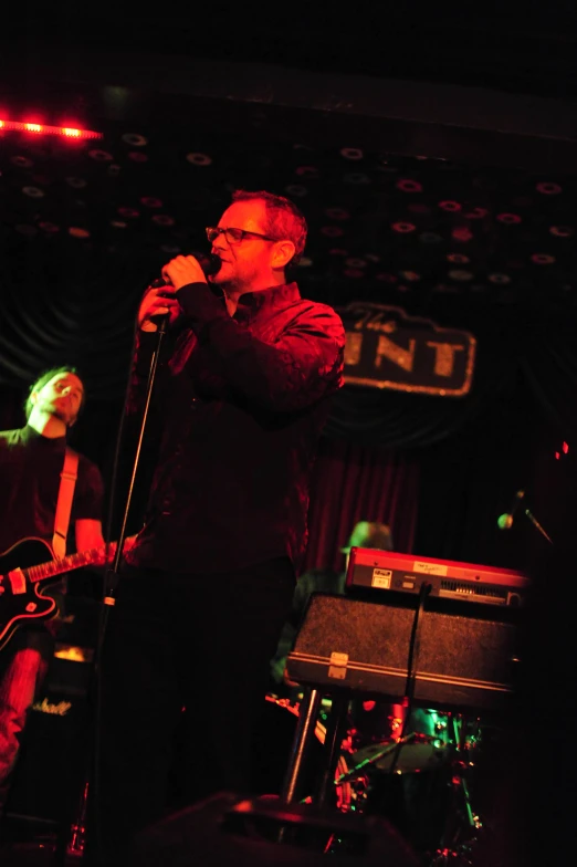 a man standing in front of a microphone