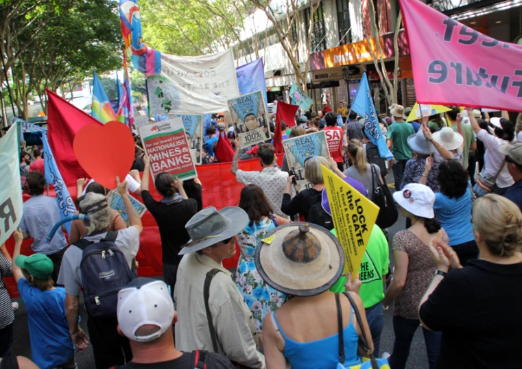 large group of people in a protest on the street