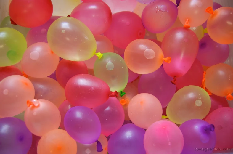 the small group of balloons are colorful