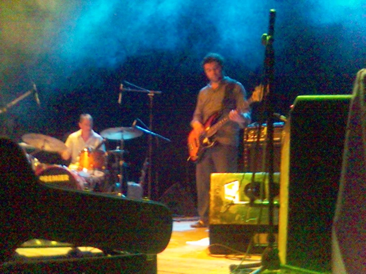 a couple of men on stage playing instruments