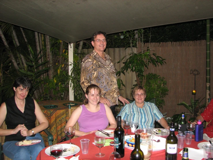 a group of people sitting at a table together