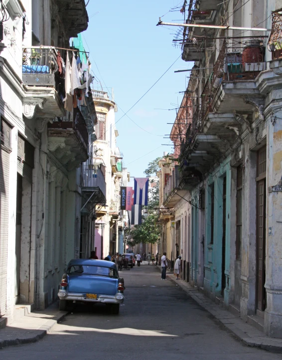 a car that is parked near some buildings