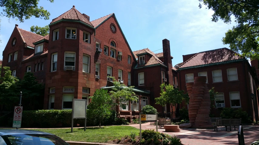 the brick building has many windows and brick roof