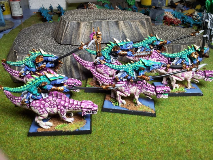 warhammer miniatures and a dragon warhammer are on a board game
