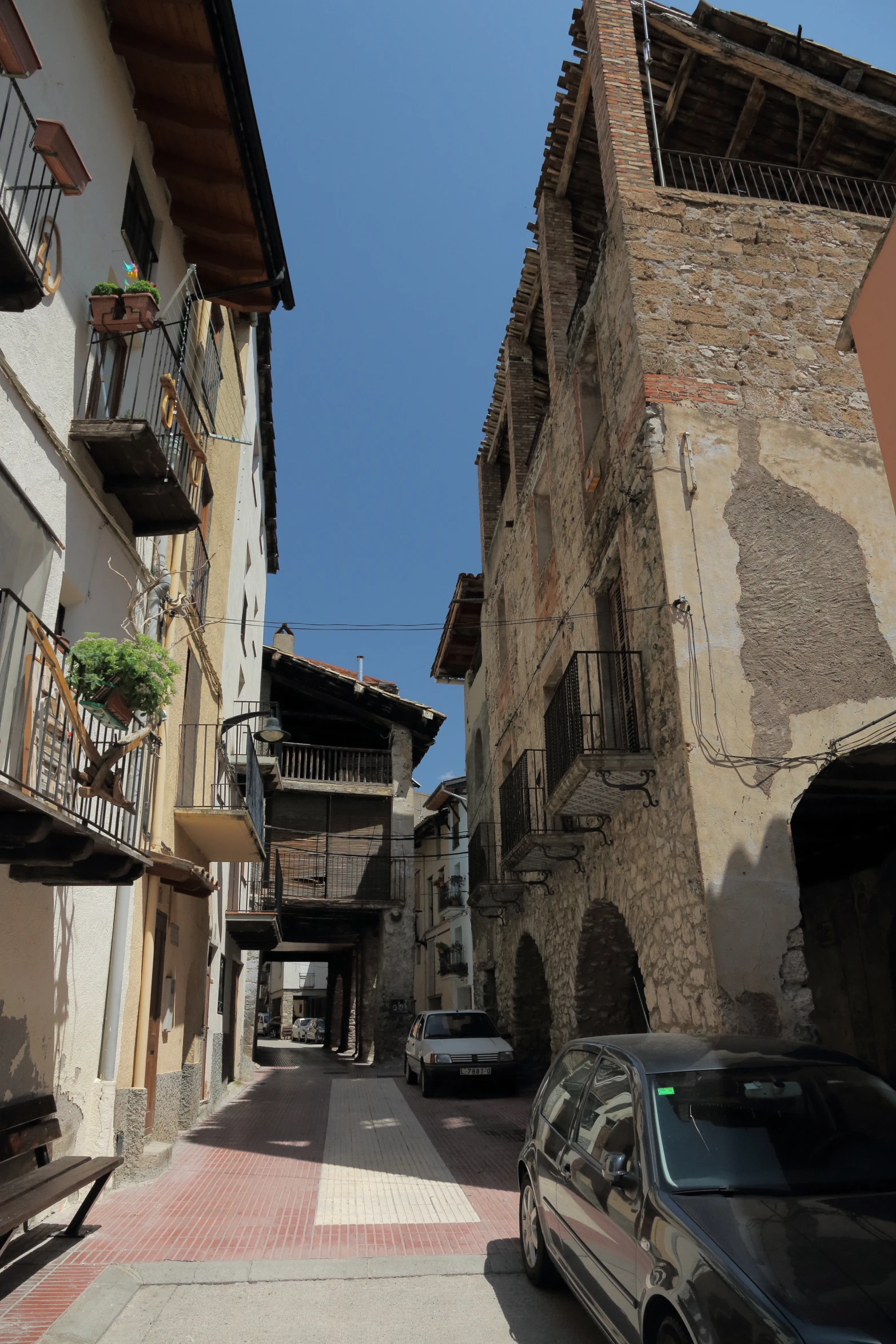 a couple of vehicles are parked in a street