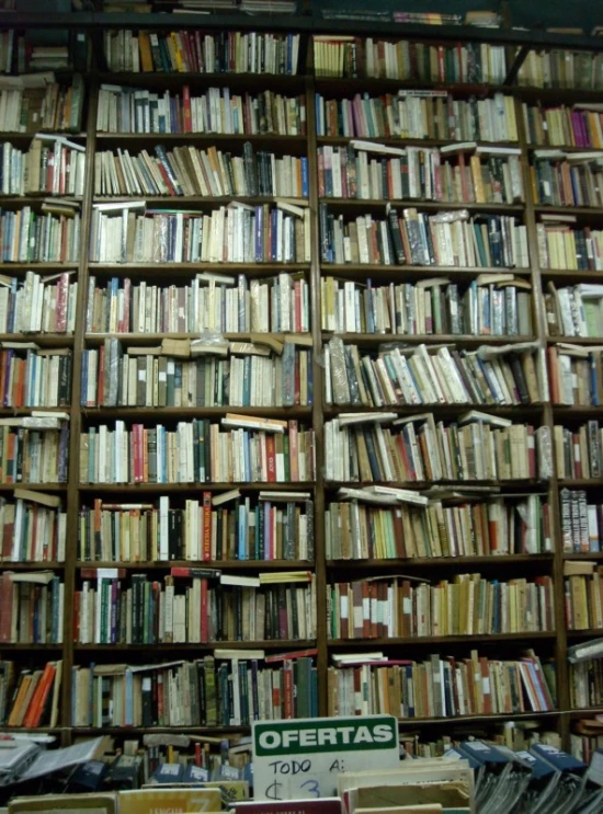 a large bookshelf that is full of many different books