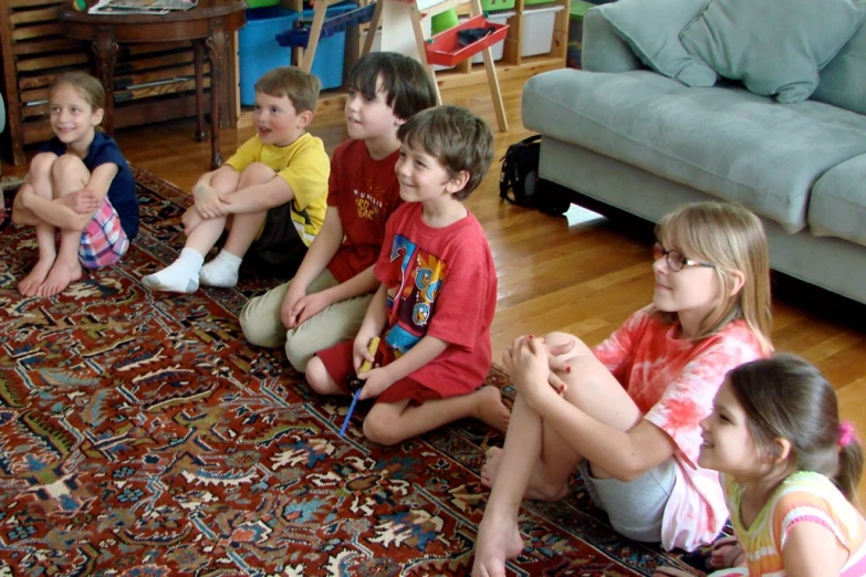 several s are sitting in the living room on the floor