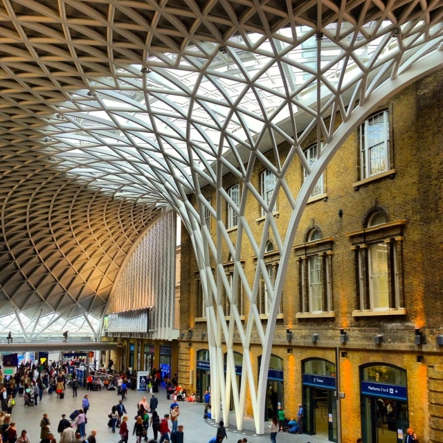 an indoor courtyard with people walking around and the ceiling