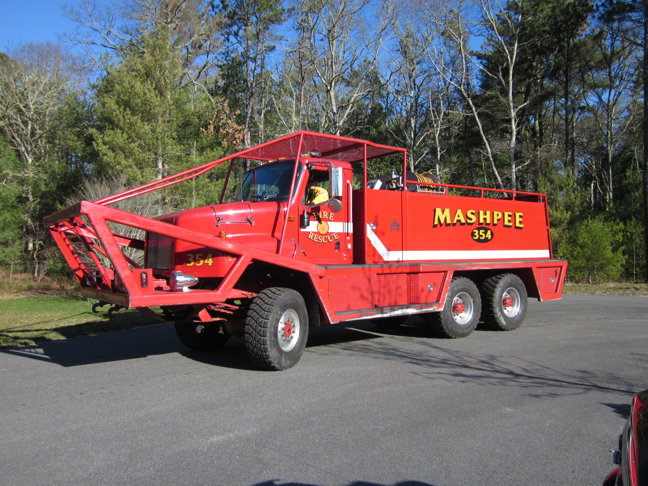 a large fire truck that is red and yellow