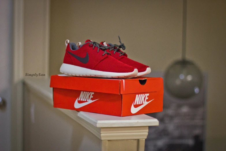 nike is selling the roshe for $ 100 with a red box