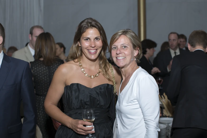 a man and a woman in formal attire at an event