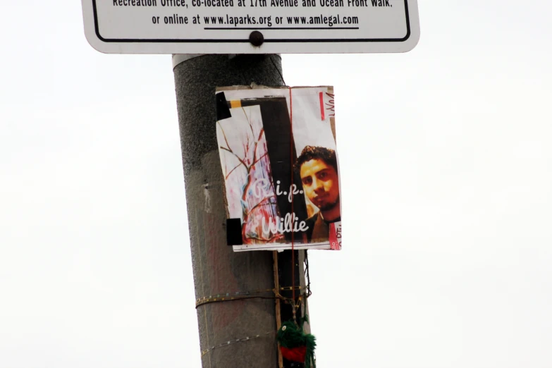 a street sign attached to a wooden pole